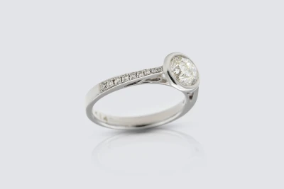 18ct White Gold 1.01ct Diamond Brilliant Cut Rubover Engagement Ring with 0.14ct Shoulder Diamonds